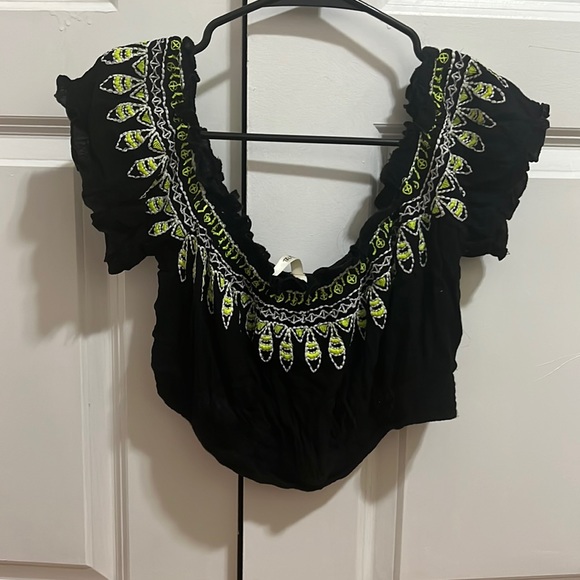 Black crop top with lime green and white tribal print. - Picture 1 of 2